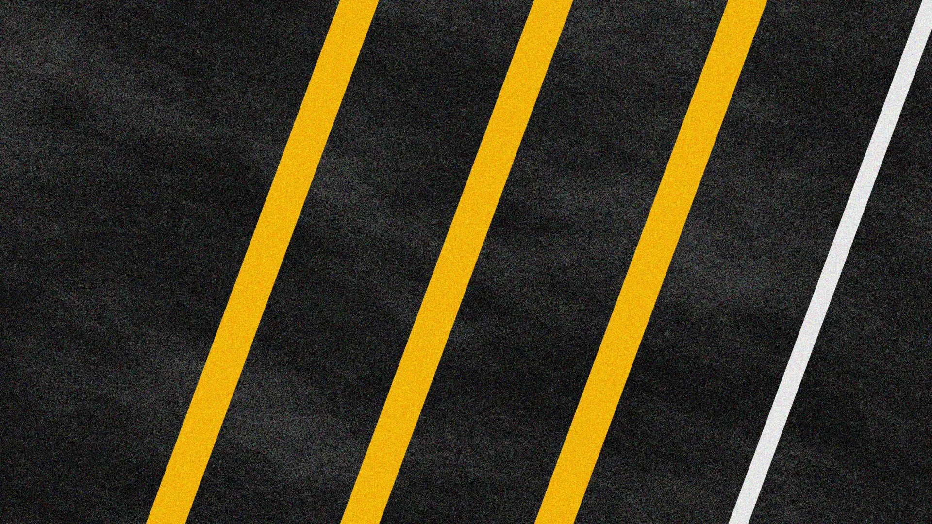 Fresh yellow parking lot striping on new asphalt in Jackson, MS
